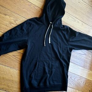 Reigning Champ large black hoodie.